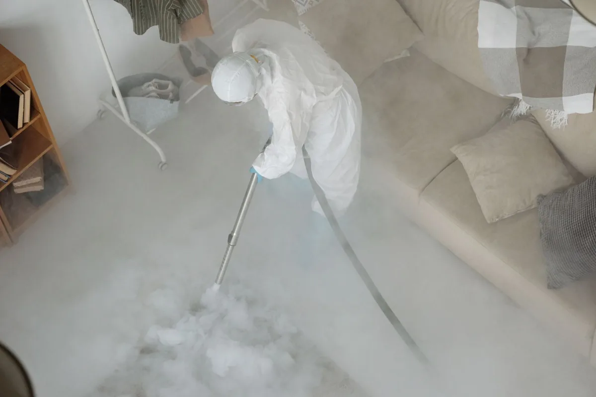 Biohazard cleanup technician in protective equipment, Bayou La Batre, AL